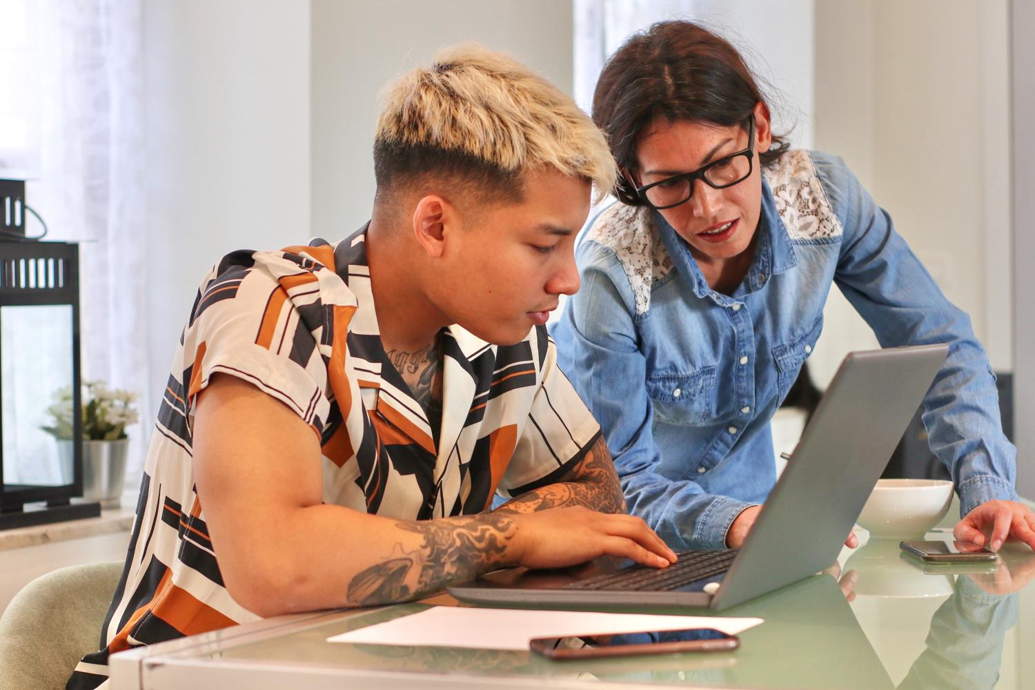 Two people genuinely working something out together. Warm, equal, relational.