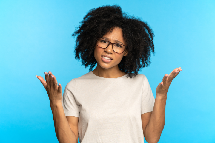 woman shrugging her shoulders