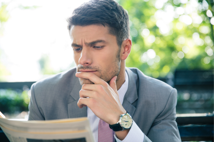 A person reading a magazine.