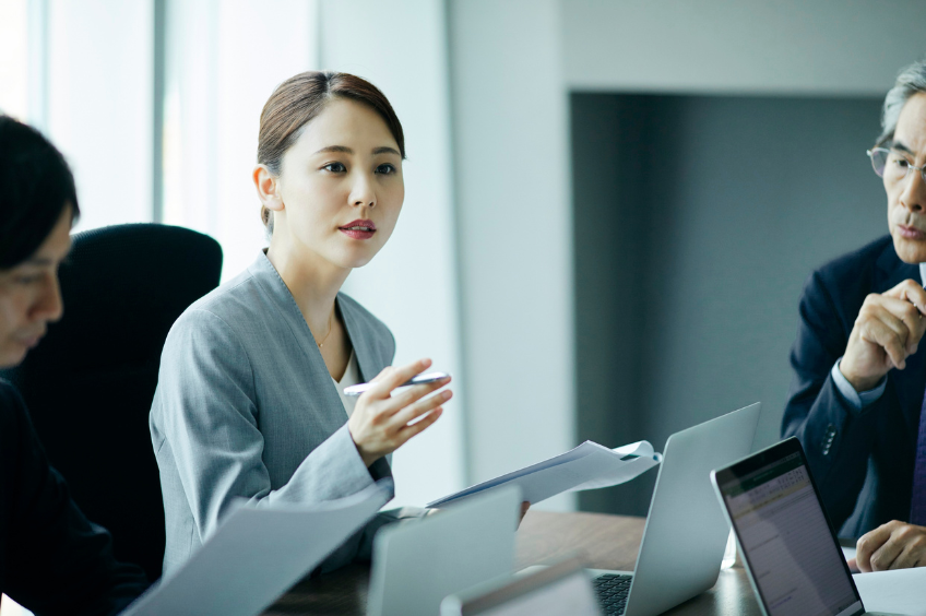 woman speaking to team member in plain language