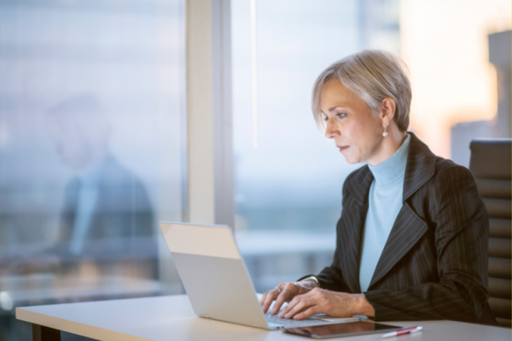 A person at a computer who appears to be working late.