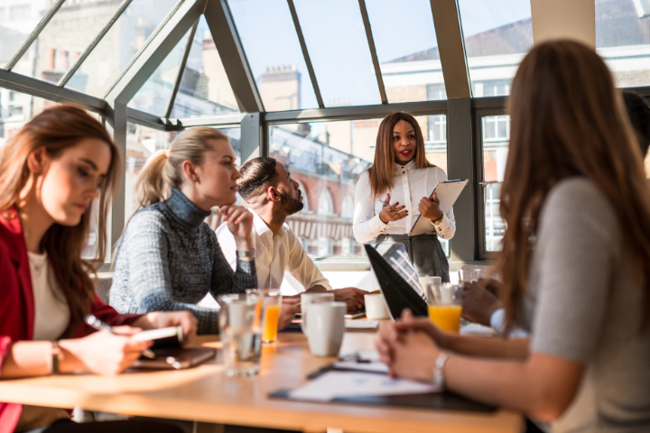 People at a conference table working together.