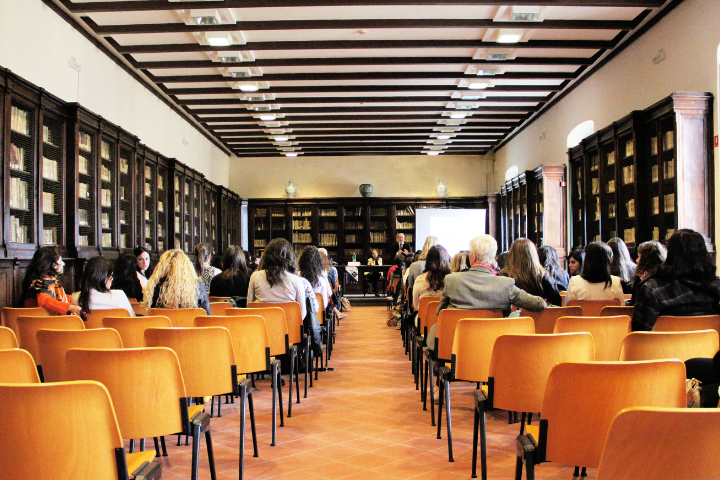 A small conference room with enaged participants.