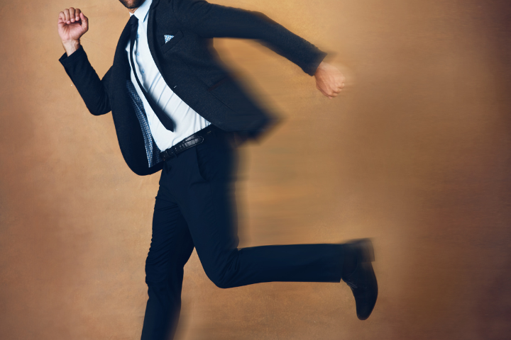A person in a suit running.